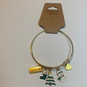 Handmade gold tone stainless steel bracelet with 5 charms.